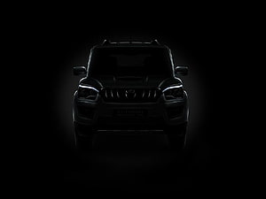 Mahindra Scorpio Front View in Dramatic Black Lighting with Glowing LED Headlights HD wallpaper