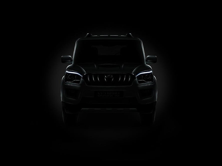 Mahindra Scorpio Front View in Dramatic Black Lighting with Glowing LED Headlights HD wallpaper