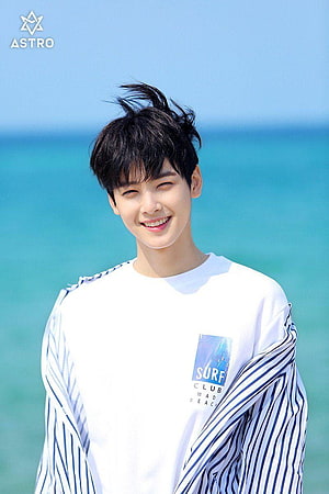 Cha Eun Woo of ASTRO Smiling in White Surf Club Tee by the Turquoise Sea HD phone wallpaper