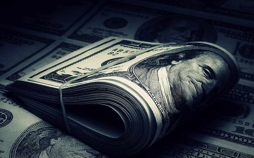 Stack of US Dollar Bills with Benjamin Franklin Portrait in Dark Moody Lighting HD wallpaper