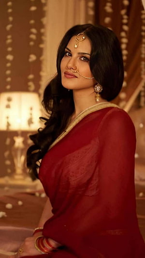 Sunny Leone in a Deep Red Saree with Traditional Gold Jewelry and Nose Ring HD phone wallpaper