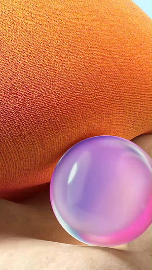 Iridescent Purple Sphere on Textured Orange Fabric HD phone wallpaper