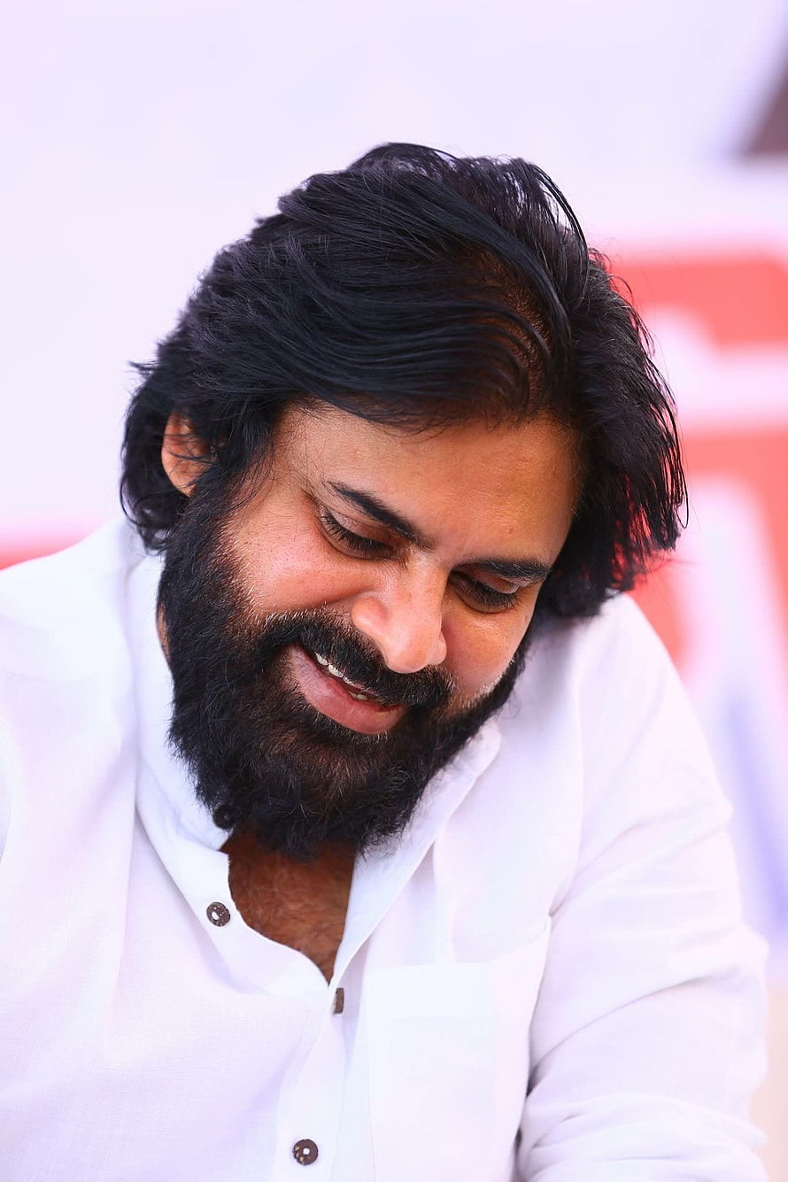 Pawan Kalyan smiling in a white shirt with a full beard and styled dark hair HD phone wallpaper