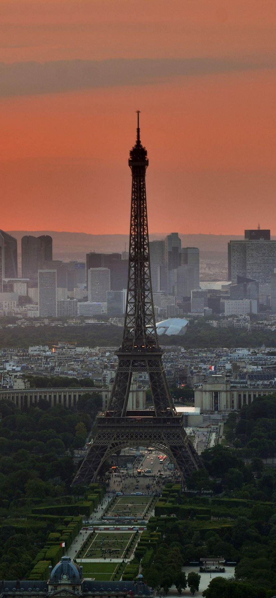 Eiffel Tower Silhouette Against a Warm Sunset Sky Over the Paris Cityscape HD phone wallpaper