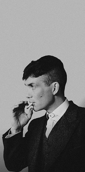 Thomas Shelby in a Three-Piece Suit Smoking a Cigarette in Black and White HD phone wallpaper