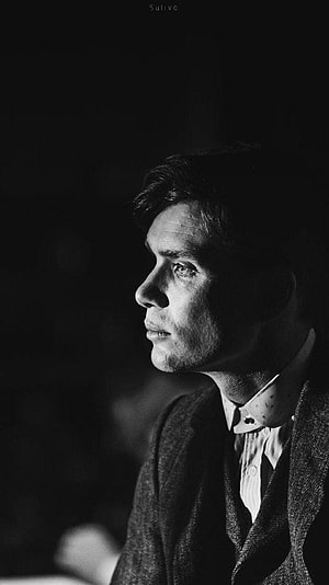 Tommy Shelby from Peaky Blinders in Dramatic Black and White Profile Portrait HD phone wallpaper