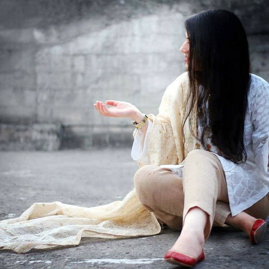 Elegant Woman in Traditional Attire Sitting on Concrete Ground HD phone wallpaper