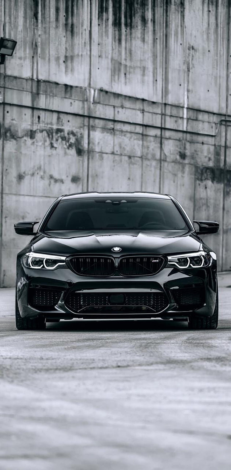 Black BMW M5 F10 Front View Against Concrete Wall HD phone wallpaper