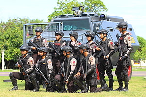 Indonesian Police Mobile Brigade Officers Posing With Armored Vehicle HD wallpaper