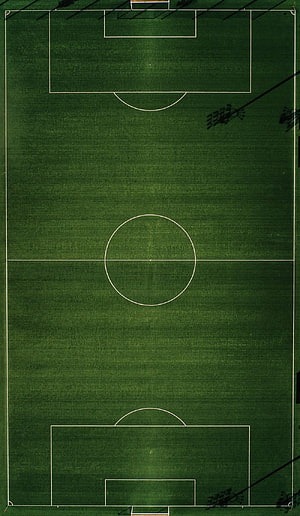 Aerial View of an Empty Soccer Pitch with White Field Markings on Green Grass HD phone wallpaper
