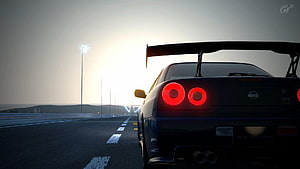 Nissan Skyline GT-R R34 Rear View on Coastal Highway at Sunset HD wallpaper