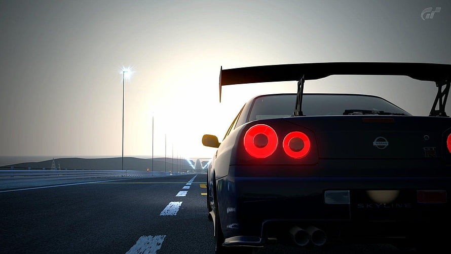 Nissan Skyline GT-R R34 Rear View on Coastal Highway at Sunset HD wallpaper