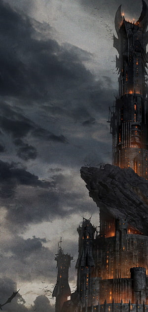 Dark Gothic Castle Tower on Rocky Cliff Under Stormy Sky HD phone wallpaper