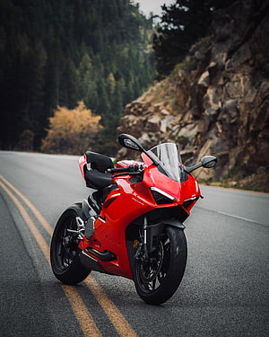 Red Ducati Panigale V2 Superbike Parked on a Winding Mountain Road HD phone wallpaper