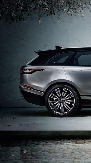 Silver Range Rover Velar Rear Quarter View with Chrome Wheels and Cherry Blossoms HD phone wallpaper