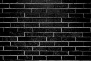 Dark Charcoal Brick Wall Pattern with Rough Masonry Texture and Industrial Grunge Aesthetic HD wallpaper