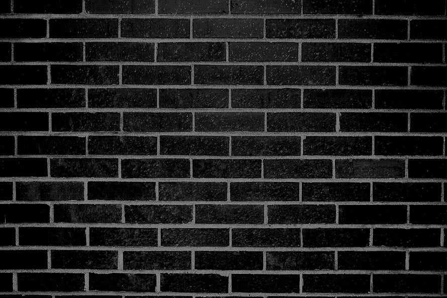Dark Charcoal Brick Wall Pattern with Rough Masonry Texture and Industrial Grunge Aesthetic HD wallpaper