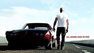 Fast and Furious 7 promotional still featuring a man walking beside a classic muscle car on an open highway HD wallpaper