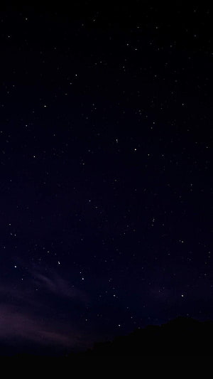 Starry Night Sky Over Dark Mountain Silhouette with Faint Clouds HD phone wallpaper
