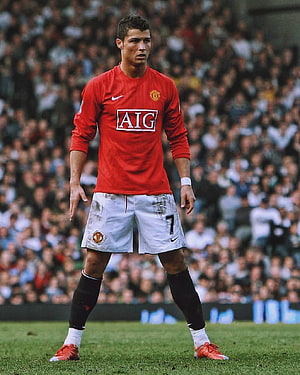 Cristiano Ronaldo in Manchester United Home Kit on the Pitch HD phone wallpaper