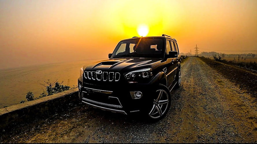Black Mahindra Scorpio S11 Modified SUV Parked on Gravel Road at Sunset HD wallpaper