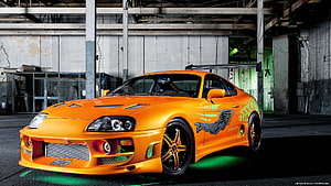 Orange Toyota Supra MK4 with Custom Graphics in Industrial Garage HD wallpaper