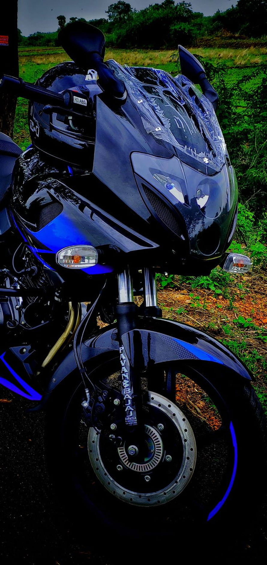 Black Bajaj Pulsar 220F Sport Motorcycle Front View in Rural Landscape HD phone wallpaper