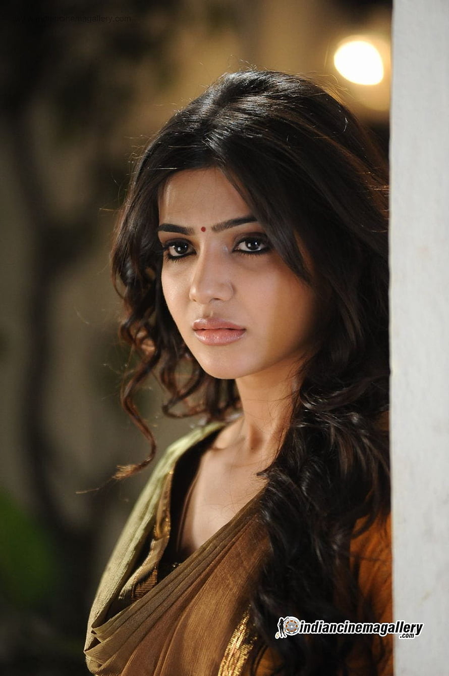 Indian Actress in Traditional Saree with Melancholic Expression and Soft Lighting HD phone wallpaper