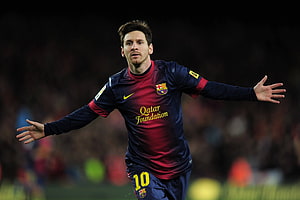 Lionel Messi in Barcelona Away Kit with Arms Outstretched on the Pitch HD wallpaper