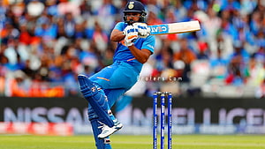 Rohit Sharma executing a powerful pull shot in Indian cricket blue kit HD wallpaper