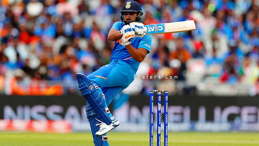Rohit Sharma executing a powerful pull shot in Indian cricket blue kit HD wallpaper