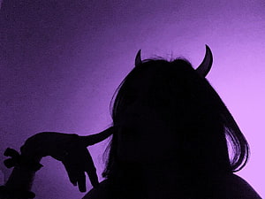 Silhouette of a girl with devil horns against a purple gradient background HD wallpaper