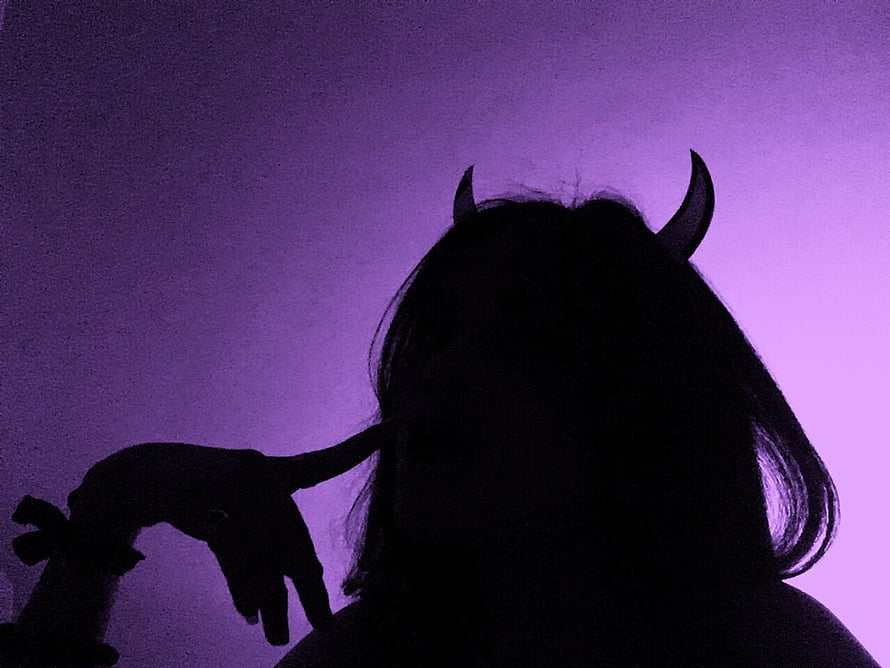 Silhouette of a girl with devil horns against a purple gradient background HD wallpaper