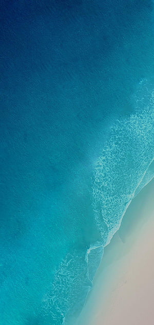 Aerial View of Turquoise Ocean Waves Meeting White Sand Beach HD phone wallpaper
