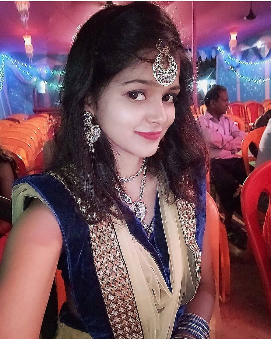Young woman in traditional Indian ethnic wear with ornate silver jewelry at a festive event HD phone wallpaper