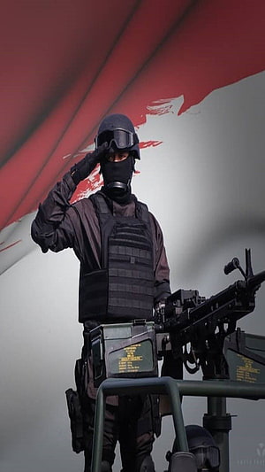 TNI Special Forces Soldier Saluting with Machine Gun and Tactical Gear HD phone wallpaper