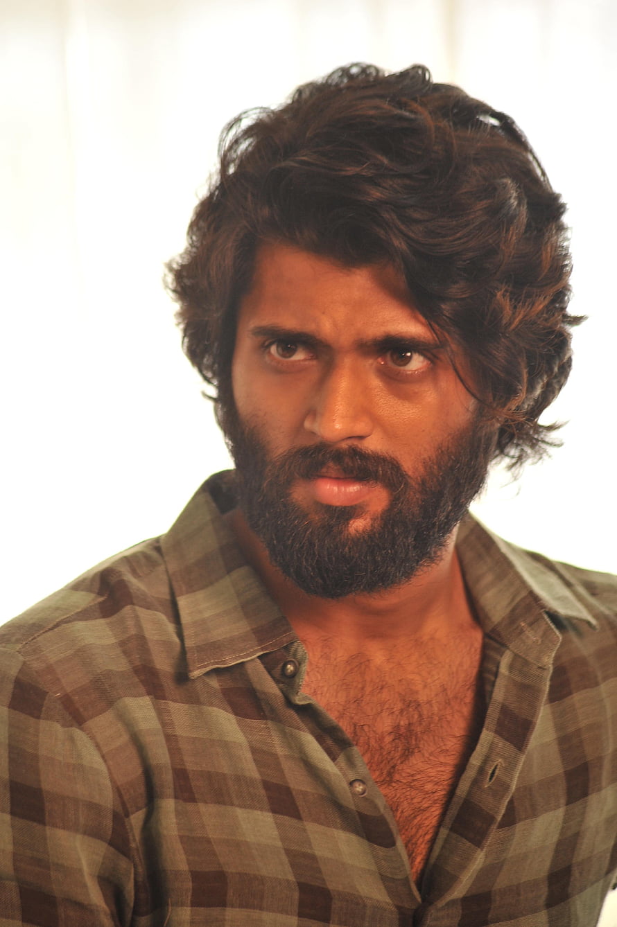 Arjun Reddy Portrait in Checkered Shirt with Intense Gaze and Full Beard HD phone wallpaper