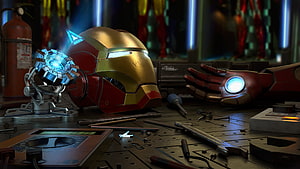 Iron Man Helmet and Arc Reactor on a Cluttered Workshop Bench HD wallpaper