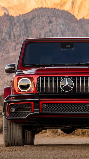 Red Mercedes-AMG G-Class Front Grille and Headlights in Desert Landscape HD phone wallpaper