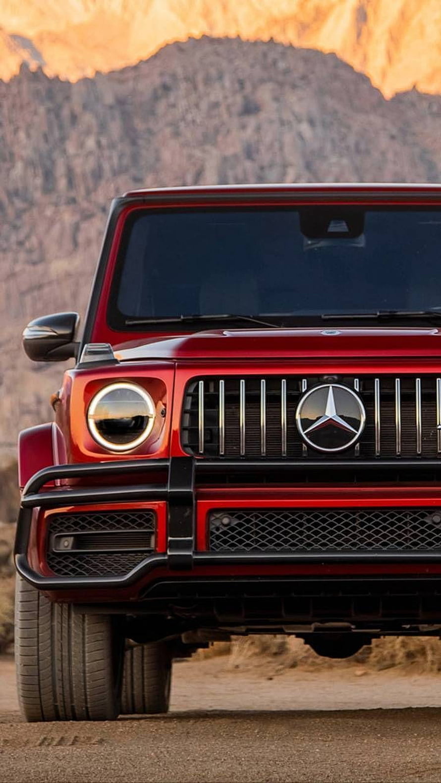 Red Mercedes-AMG G-Class Front Grille and Headlights in Desert Landscape HD phone wallpaper