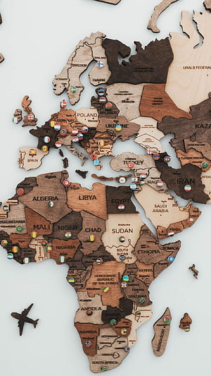 Laser-Cut Wooden World Map Wall Art with Travel Pins and Airplane Decor HD phone wallpaper
