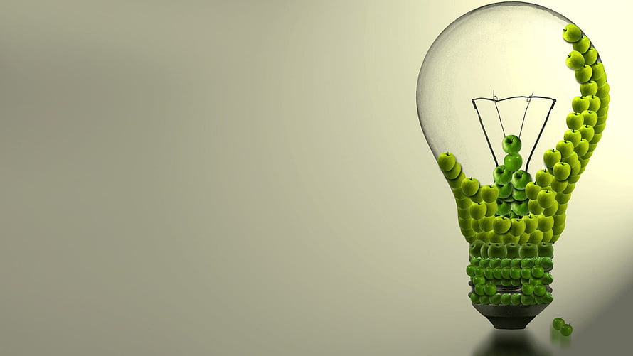 Green Apple Light Bulb Concept for Sustainable Energy and Eco-Friendly Innovation HD wallpaper