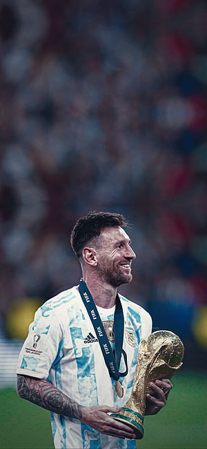 Lionel Messi Holding The FIFA World Cup Trophy In Argentina Kit HD phone wallpaper