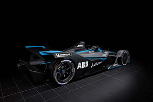ABB FIA Formula E Gen2 race car with Michelin tires on a dark studio grid HD wallpaper