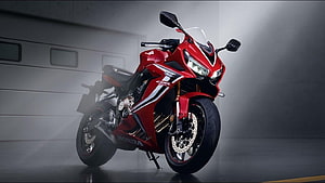Red Honda CBR650R Sport Motorcycle in Studio Setting HD wallpaper