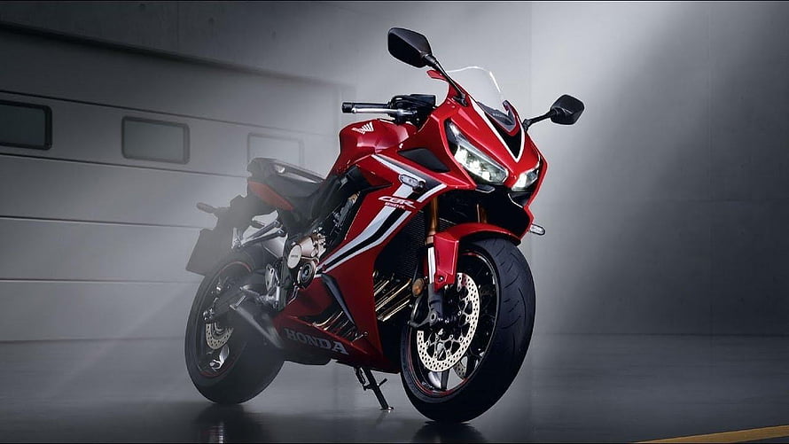 Red Honda CBR650R Sport Motorcycle in Studio Setting HD wallpaper