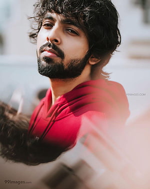 G. V. Prakash Kumar Portrait in Red Hoodie with Curly Hair and Beard HD phone wallpaper