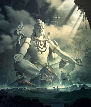Colossal Shiva Statue in Meditative Pose Amidst Misty Mountains and Ancient Temple Ruins HD phone wallpaper