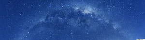 Milky Way Galaxy Spanning a Deep Blue Night Sky with Scattered Stars and Nebulae HD wallpaper