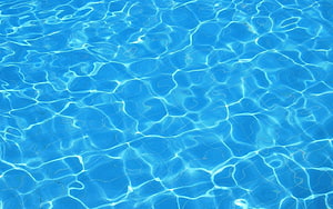 Crisp Blue Swimming Pool Water Surface With Sunlight Caustics and Ripples HD wallpaper